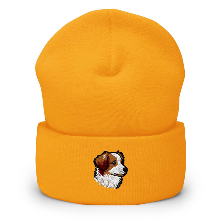 a yellow beanie with a picture of a dog on it