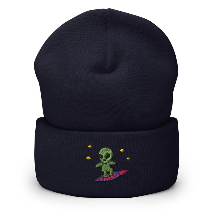 a beanie hat with an alien surfing on it
