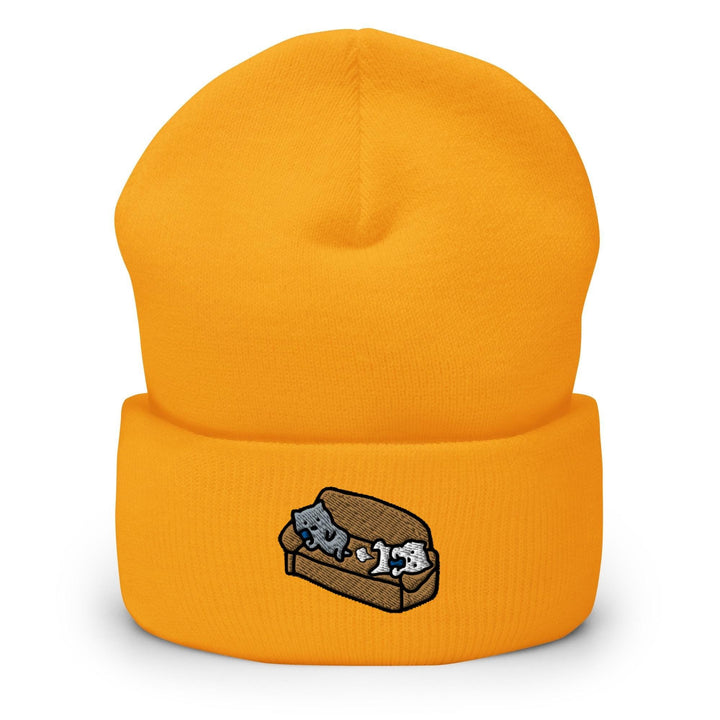 a yellow hat with two cats inside of it