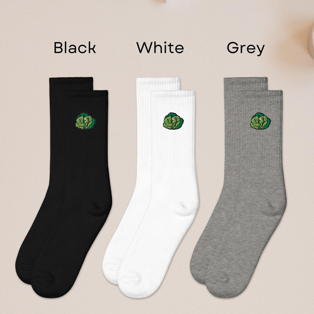 three pairs of black, white, and grey socks