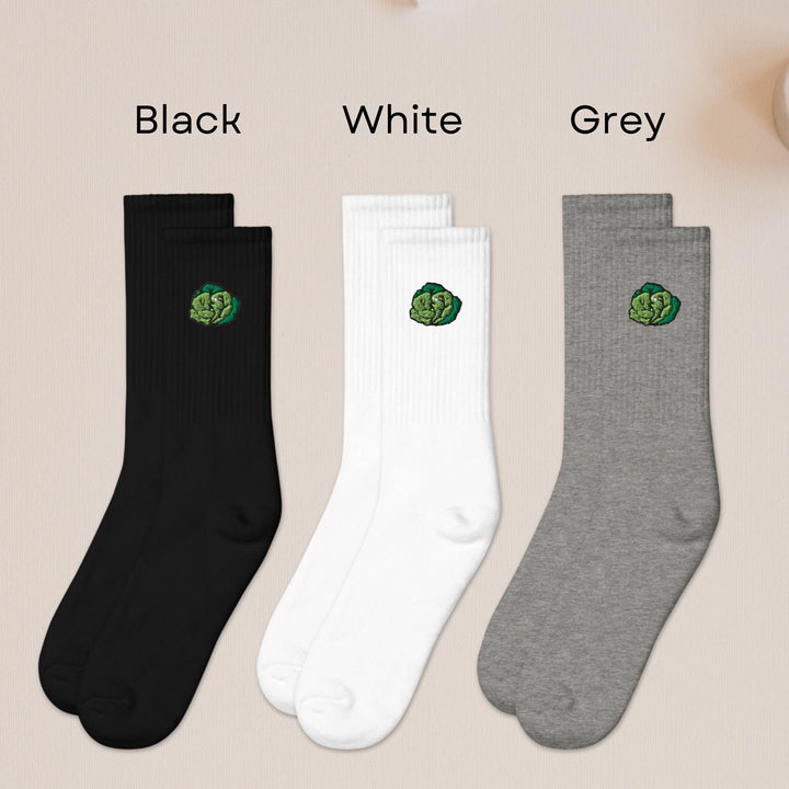 three pairs of black, white, and grey socks