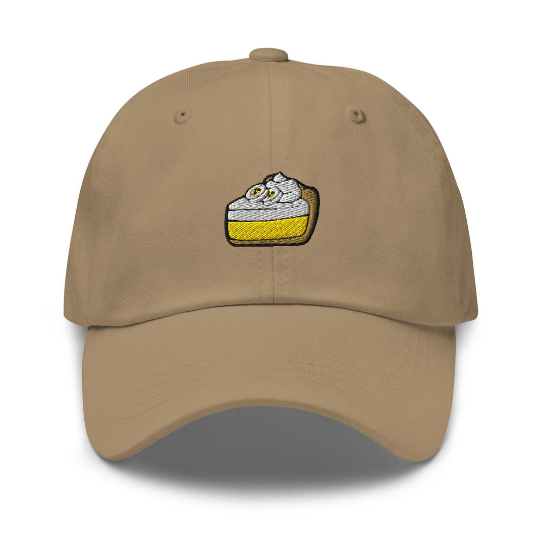 a tan hat with a piece of cake embroidered on it
