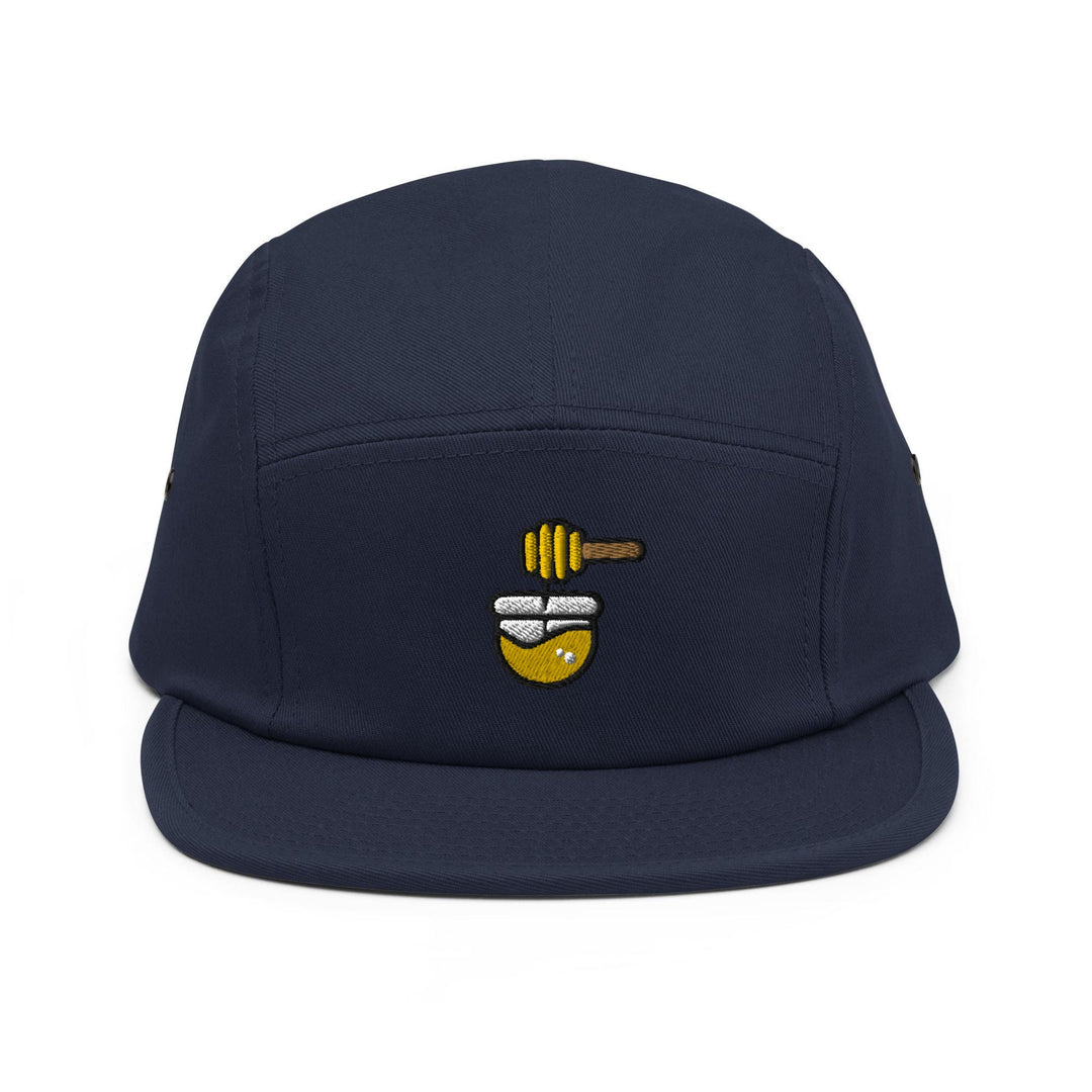 a blue hat with a bee on it