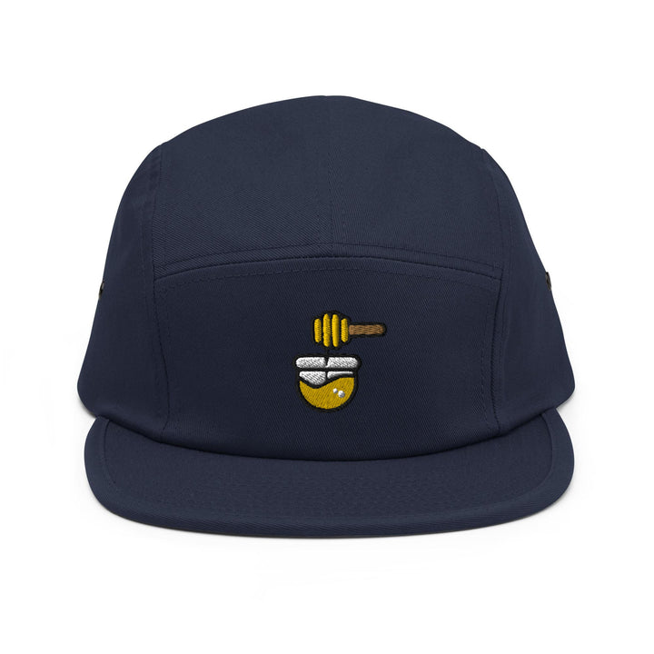 a blue hat with a bee on it