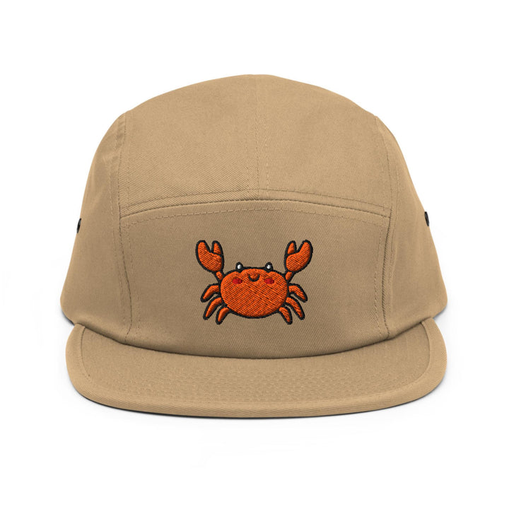 a tan hat with a crab embroidered on it