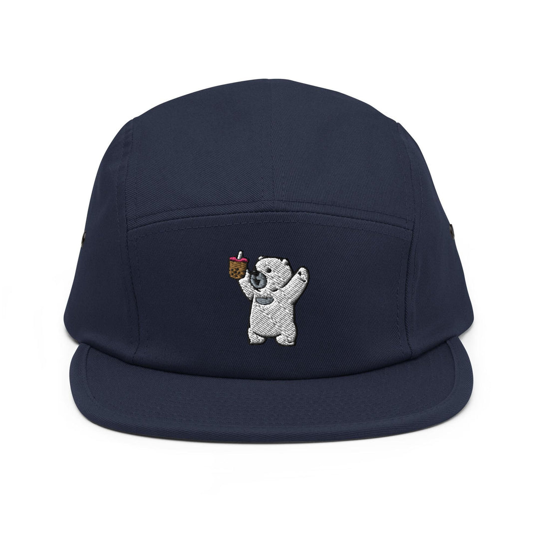 a baseball cap with a bear holding an apple