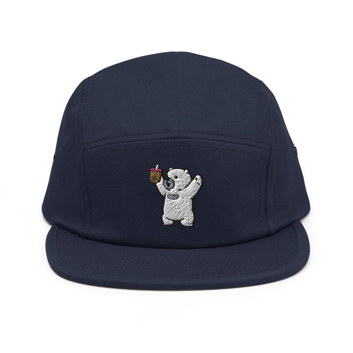a baseball cap with a bear holding an apple