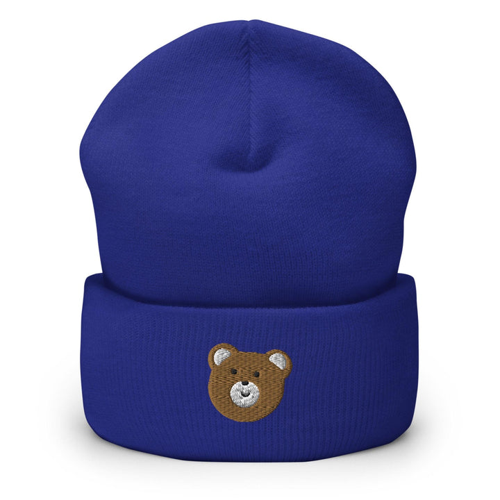 a blue beanie with a brown teddy bear on it