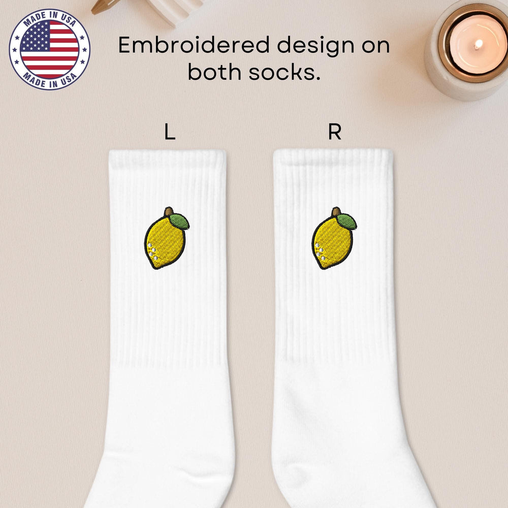 a pair of white socks with lemons on them