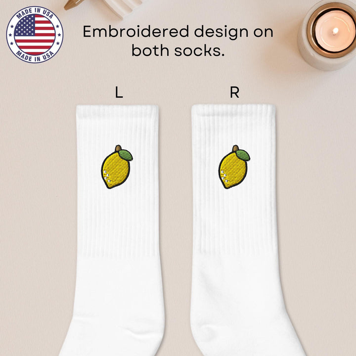a pair of white socks with lemons on them
