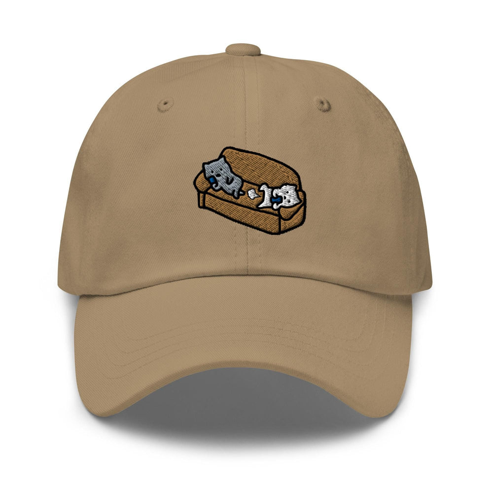 a tan hat with two cats on a piece of bread