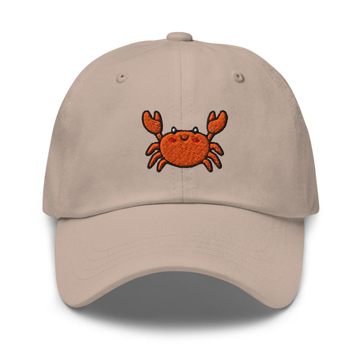 a tan hat with a crab embroidered on it