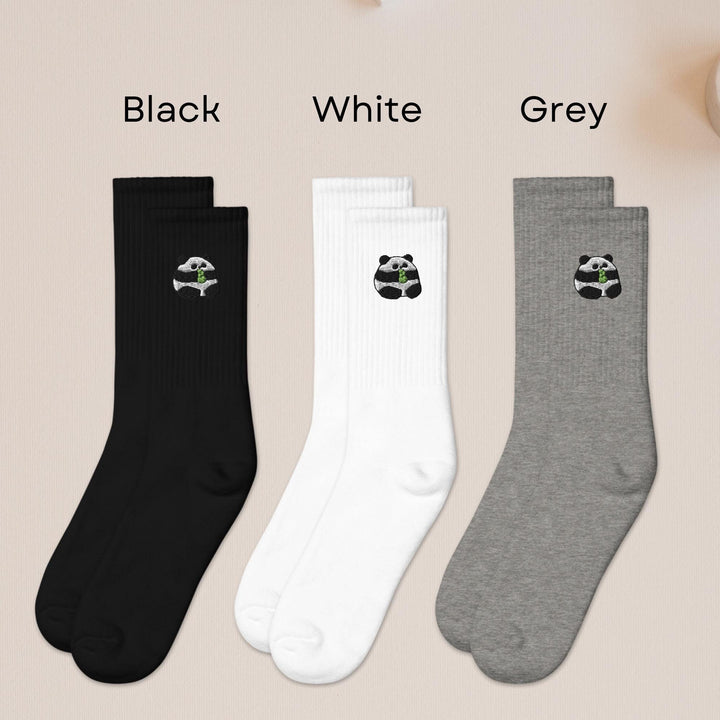 three pairs of socks with panda bears on them