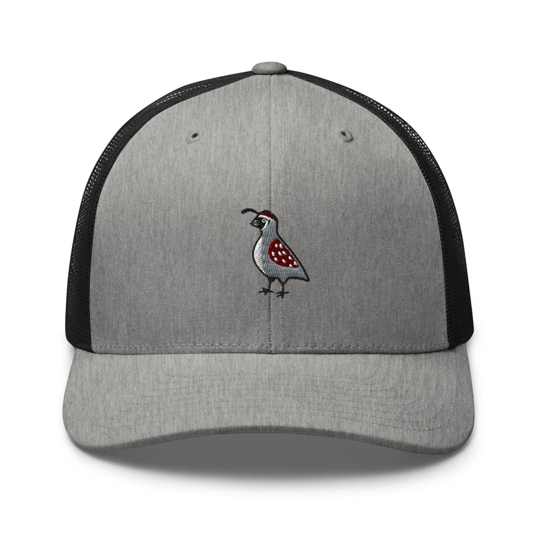 a gray and black hat with a bird embroidered on it