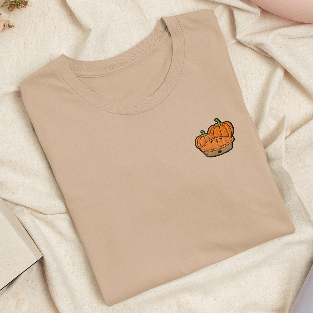 a t - shirt with a picture of a pumpkin on it