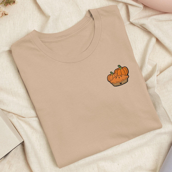 a t - shirt with a picture of a pumpkin on it