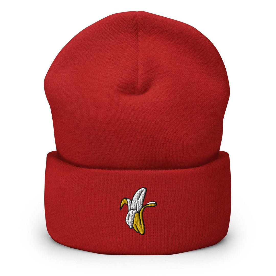a red beanie with a banana embroidered on it