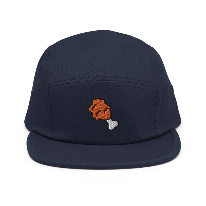 a blue hat with an orange bear embroidered on it