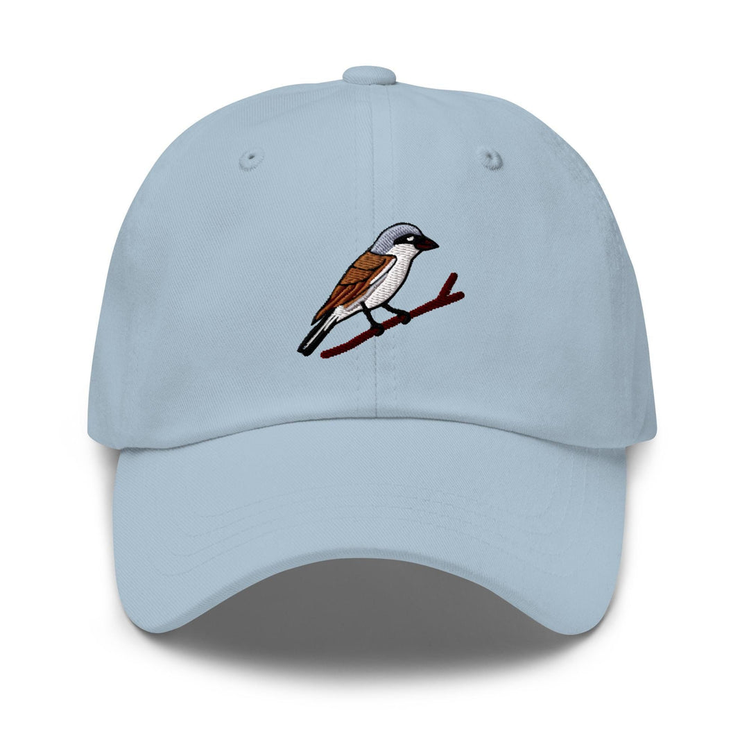 a light blue hat with a bird on it
