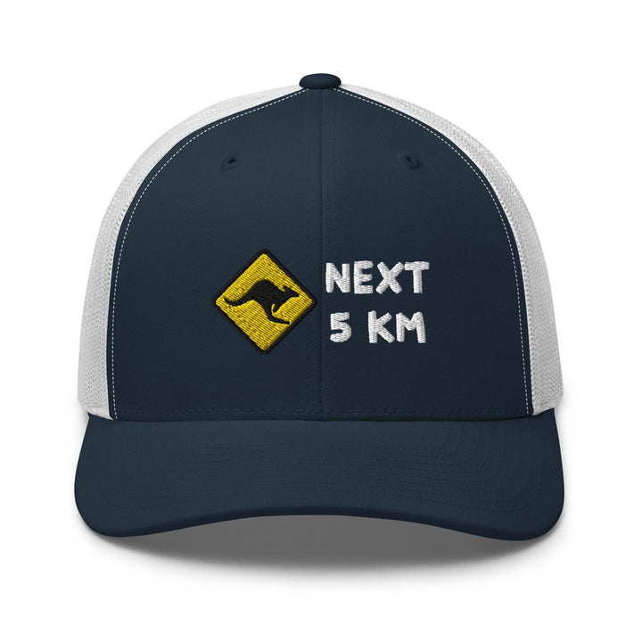 a trucker hat with the words next 5 km printed on it