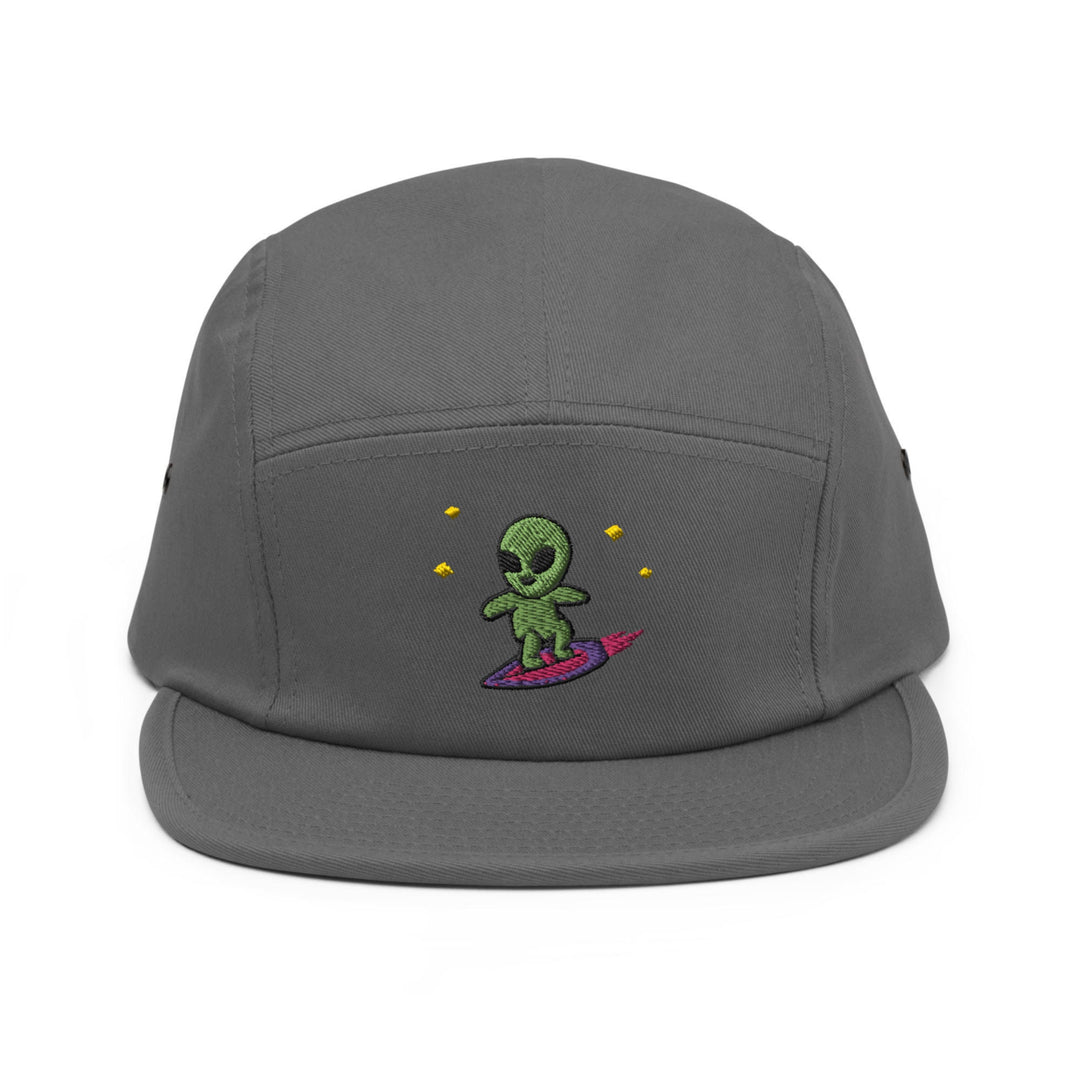 a grey hat with a green alien on it