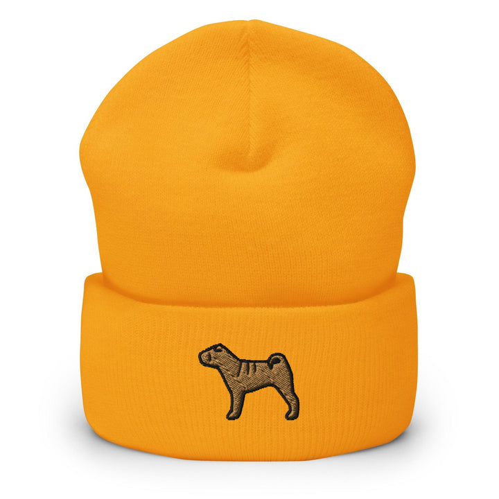 a yellow beanie with a black dog on it