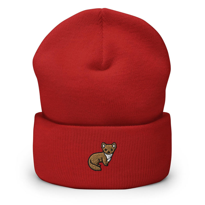 a red beanie with a brown bear embroidered on it