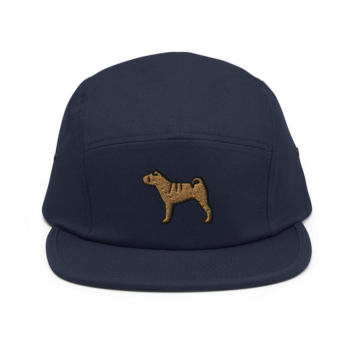 a blue hat with a brown dog embroidered on it