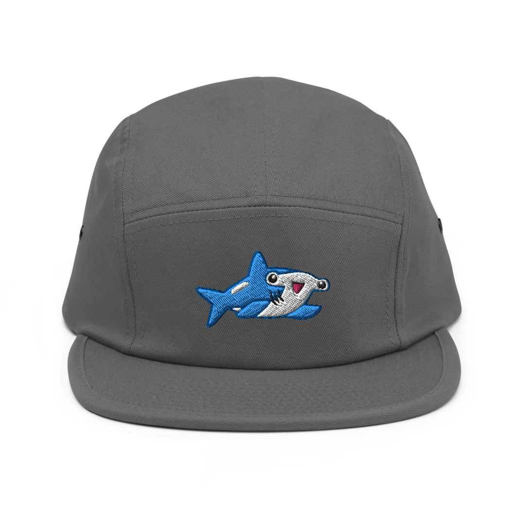 a gray hat with a shark embroidered on it