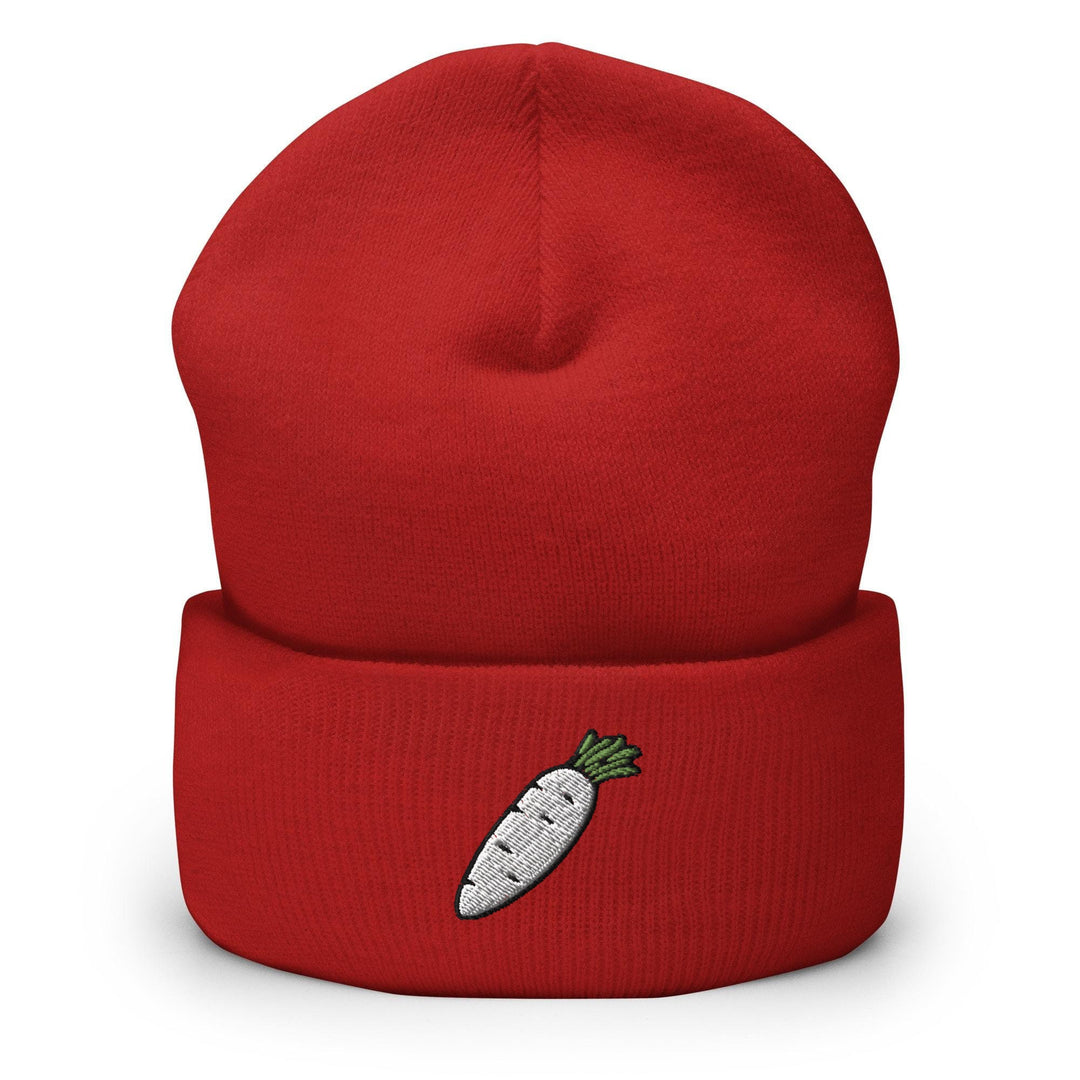 a red beanie with a carrot embroidered on it