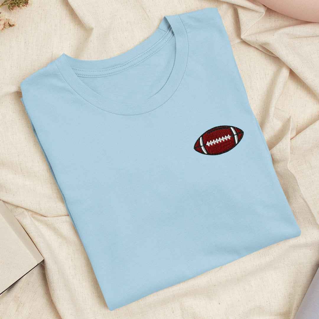 a t - shirt with a football embroidered on it