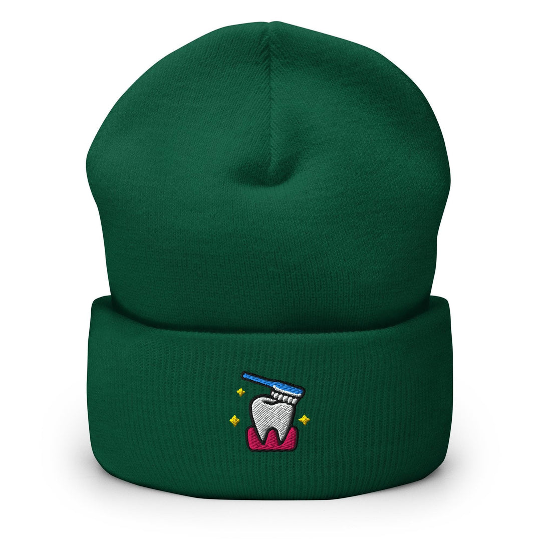 a green beanie with a tooth on it