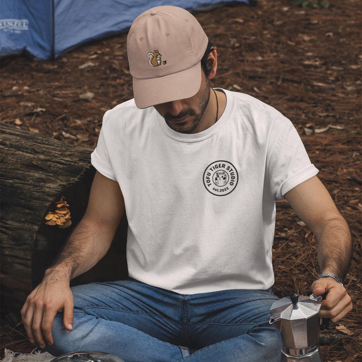 a man sitting on the ground with a cup of coffee
