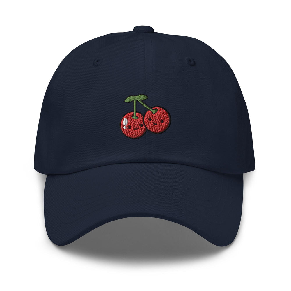 a blue hat with a cherry embroidered on it