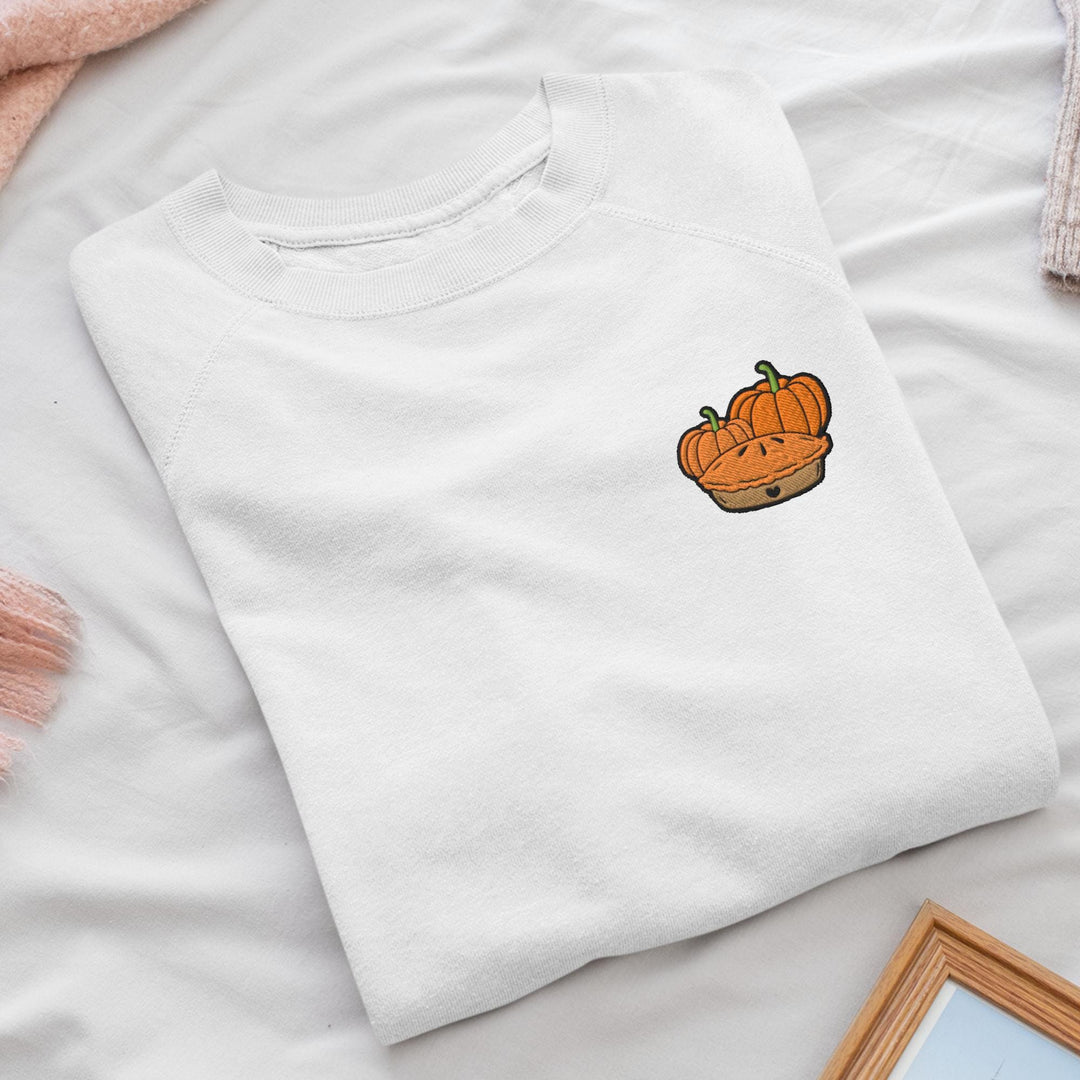 a white t - shirt with a picture of a pumpkin on it