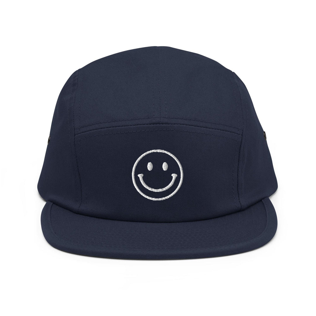 a hat with a smiley face on it
