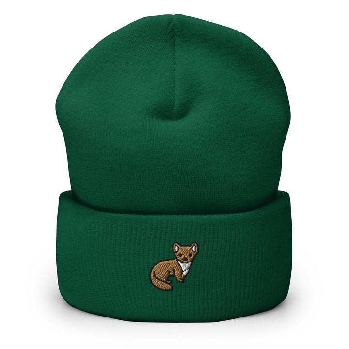 a green beanie with a brown bear on it