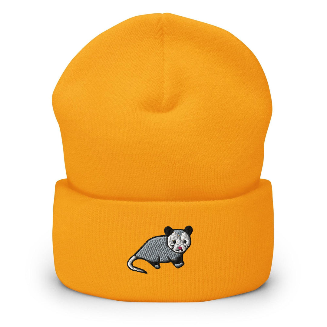 a yellow beanie with a cartoon rat on it