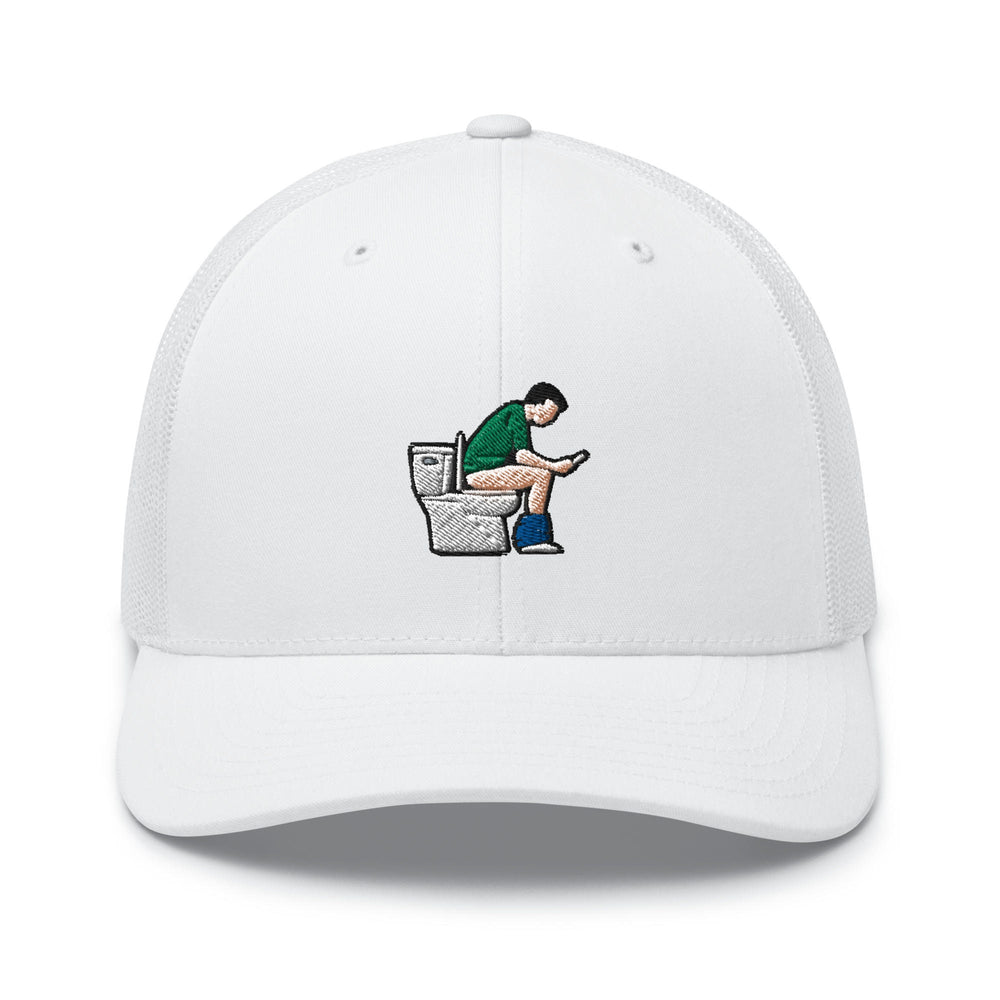 a white hat with a man sitting on a toilet