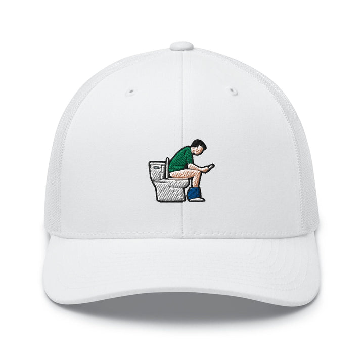 a white hat with a man sitting on a toilet