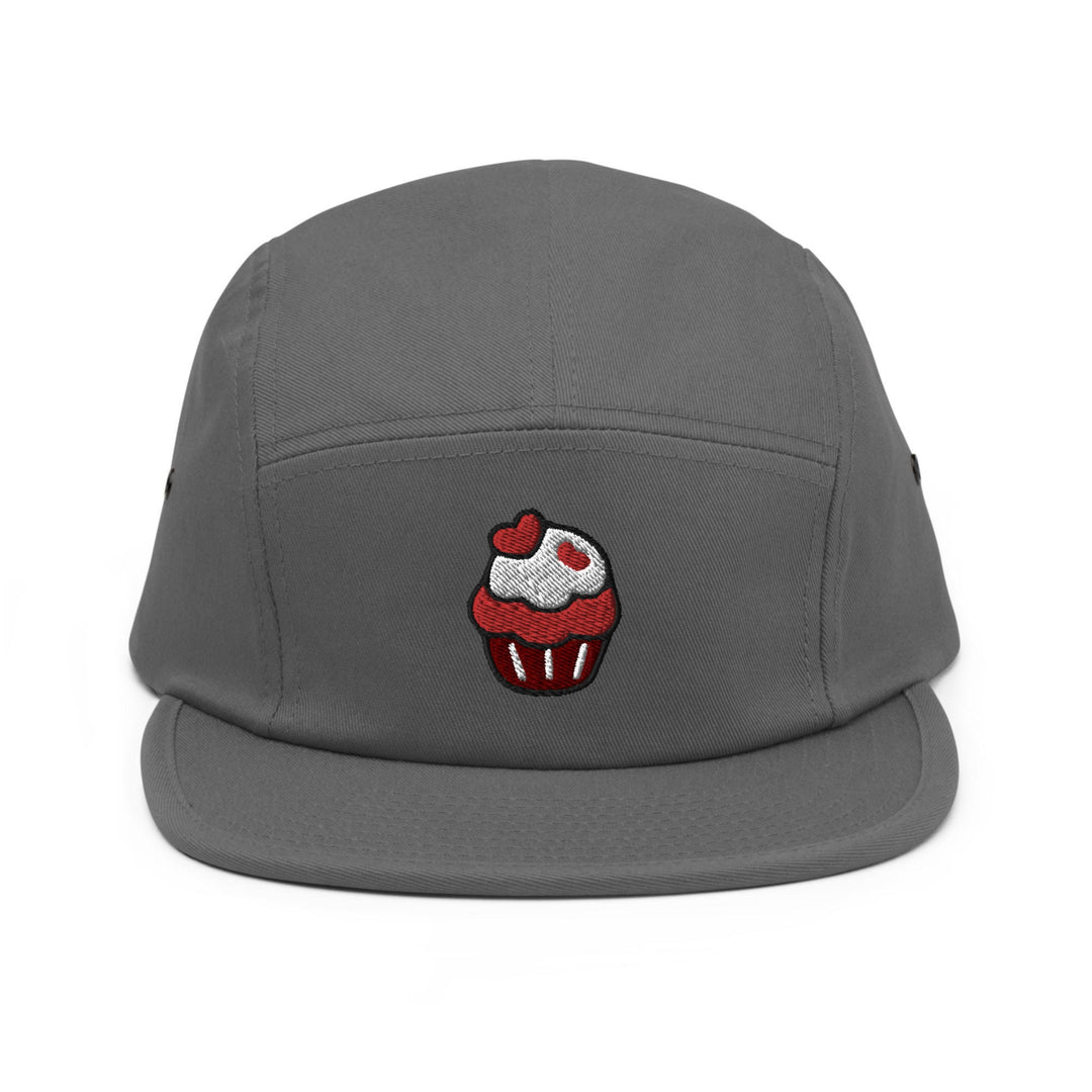 a gray hat with a cupcake embroidered on it