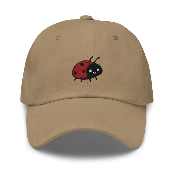 a tan hat with a ladybug embroidered on it