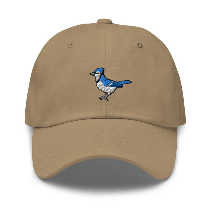 a tan hat with a blue bird embroidered on it