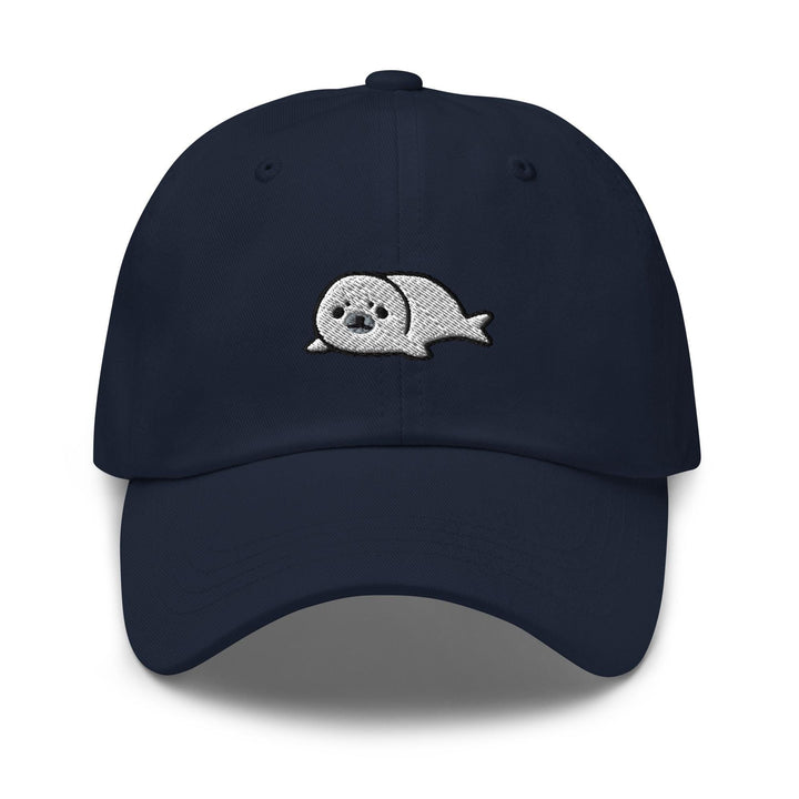 a navy hat with a white whale embroidered on it