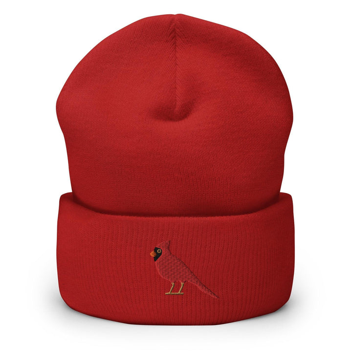 a red hat with a bird embroidered on it