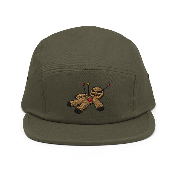 a green hat with a teddy bear embroidered on it