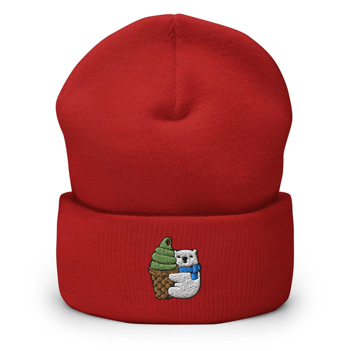 a red beanie with a bear holding an ice cream cone