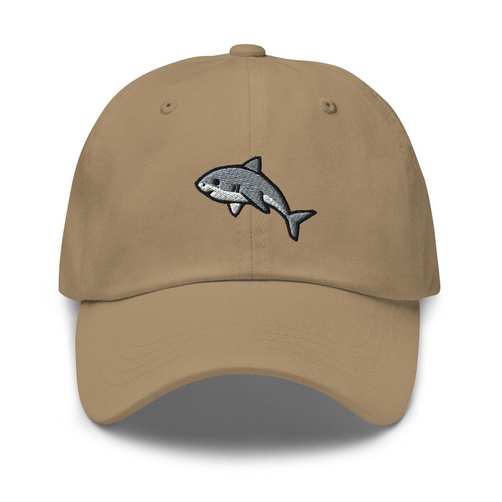 a tan hat with a shark embroidered on it