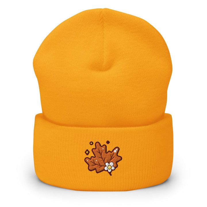 a yellow beanie with a maple leaf embroidered on it