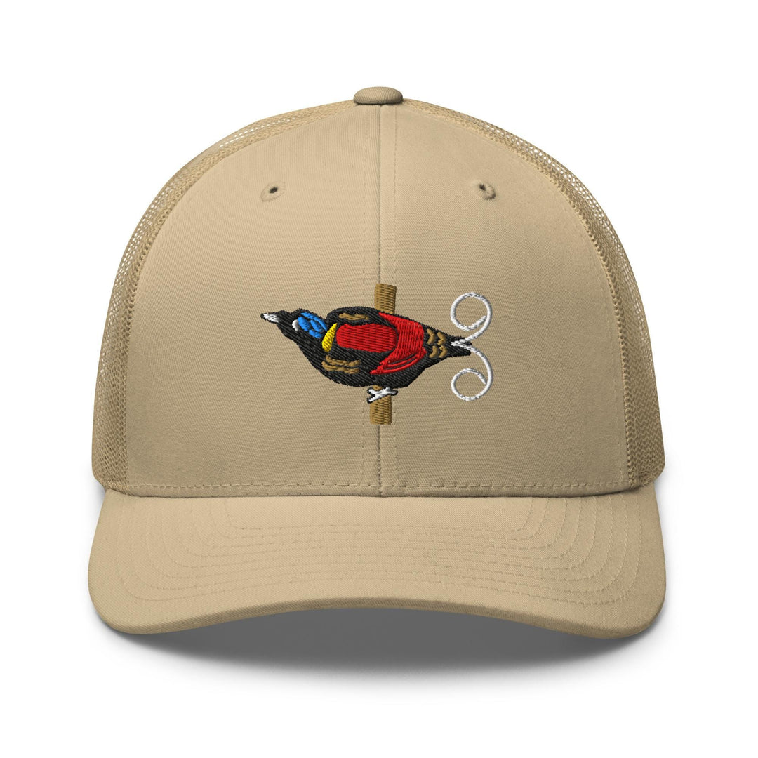 a tan hat with a bird embroidered on it